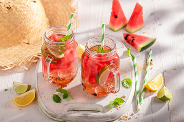 Wall Mural - Sweet and homemade lemonade with mint leaves and watermelon.