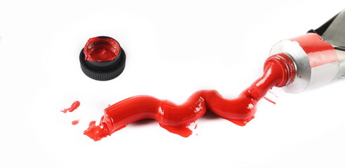 New tube with red oil paint on white, clipping path