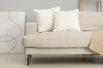 Wall Mural - Soft white pillows and blanket on sofa indoors