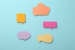 © New Africa - Equality concept. Different paper speech bubbles on light blue background, flat lay