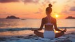 © logopiks - Young woman practicing yoga on sand at beach during sunset