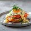 © Qaisara - a tantalizing serving of salmon benedict with deliciously poached eggs with hollandaise sauce, served on a freshly toasted bread, garnished with dill sprinkled with herbs and spices
