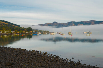 Wall Mural - Landscape Scenery of Akaroa Harbour, New Zealand in the Morning Misty Day