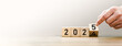 © Sutthiphong - Transitioning from 2024 to 2025 with wooden blocks symbolizing target business for the upcoming year. This represents planning, investment, and innovation as ideas move from the end of 2024 new year