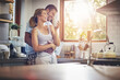 © Reese Coop/peopleimages.com - Coffee, hug and romance with couple in kitchen of home together for morning break or wellness. Cup, relax or smile with happy man and woman drinking fresh beverage or tea in apartment for love