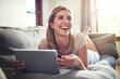 © peopleimages.com - Thinking, tablet or happy woman with credit card in home for ecommerce sale or order choice on fintech website. Ideas, easy payment or person on financial app for online shopping or discount options