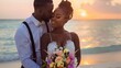 © mariiaplo - Romantic Beach Wedding Couple Embracing at Sunset