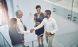 © peopleimages.com - Business people, above or handshake in agreement for greeting, meeting or partnership. Collaboration, thank you or mature boss with man for B2B support, introduction or deal for recruitment in office