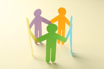 Wall Mural - Equality concept. Paper human figures on beige background, closeup