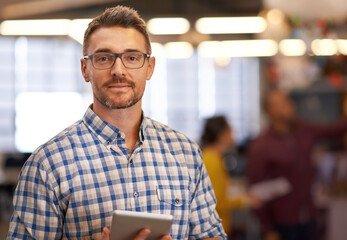 Wall Mural - Portrait, creative and business man with tablet in startup for research, email or project. Face, glasses and professional entrepreneur on digital technology for graphic designer or employee coworking