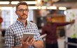 © peopleimages.com - Business, thinking and man with tablet in office, startup project and research ideas. Professional, creative agency and graphic designer with digital, planning or brainstorm for company website