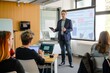 © mattegg - Businessman Giving Presentation to Attendees in Office
