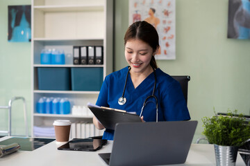 Wall Mural - Doctor work on digital tablet healthcare doctor technology tablet using computer in a modern office  in the morning at the desk.