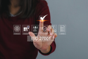 ISO 27001 concept. Businesswoman with ISO 27001 certified for information security management system (ISMS). requirements, certification, management, standards