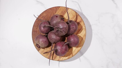 Poster - beetroot on wooden board food top view on light surface