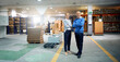 © peopleimages.com - Arms crossed, collaboration and warehouse with portrait of business people together for delivery management. Logistics, shipping or supply chain with man and woman employee in factory or plant