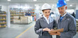 © ArcursPI/peopleimages.com - Teamwork, people and warehouse checklist with clipboard for quality inspection or logistics planning process. Management, talk or document for manufacturing supplier or man and woman in collaboration