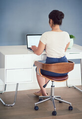 Poster - Office, computer and back of business woman at desk working on online project, planning and typing email. Corporate worker, professional and person on laptop for internet, website and research