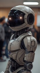 Poster - A robot with a helmet on its head. The robot is standing in a room with people around it