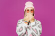 © ViDi Studio - Young surprised shocked happy lesbian woman wears pink animal clothes cover mouth with hands look camera isolated on plain purple background studio portrait. Pride day June month love LGBTQ concept.