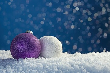 Two purple and white Christmas balls on snow against a dark blue background, with space for text