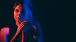 © golubovy - Mental disorder. Defocused woman. Fake calm female silhouette suffering dissociative identity red neon color empty space double exposure out of focus.