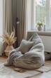 © G.Go - Panoramic view capturing a minimalist bean bag chair, elegantly placed in a spacious, Scandinavian-inspired room, soft pastel color palette, digital watercolor effect