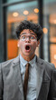 © Roberto - Shocked business professional with mouth agape in disbelief.