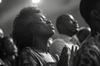 © john - a group of black people worshipping, praising, in the church, hand up, praying and singing, black and white