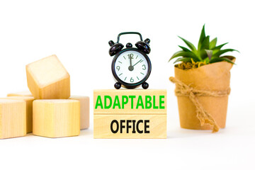 Adaptable office symbol. Concept words Adaptable office on beautiful wooden block. Beautiful white paper background. Black alarm clock. Business Adaptable office concept. Copy space.