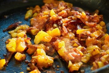 Wall Mural - Step-by-step cooking process. Fry the sliced sausage in a frying pan with tomatoes and onions