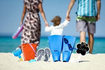 Poster - A Happy family near the sea in nature with slippers travel trip vacation