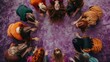 © InfiniteFlow - A group of diverse women in colorful clothing are sitting in a circle on purple sand, holding hands and looking at each other with joy and love in their eyes. AIG535
