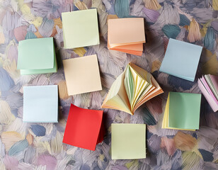 Poster - A bunch of colorful sticky notes are scattered on a table. The notes are of different sizes and colors
