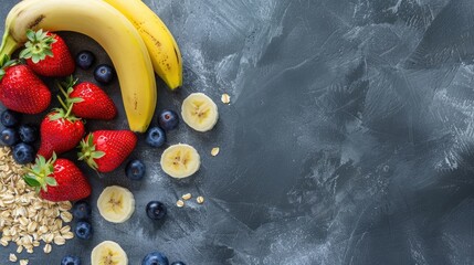 Wall Mural - Oats banana strawberries and blueberries on a grey background