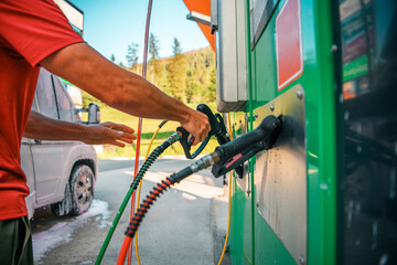 Wall Mural - Man Washing a White Camper Van at a Car Wash