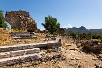 Wall Mural - View of remains of buildings and eastern city gate over ancient road of Aspendos antique town, Turkey