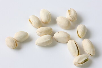 Wall Mural - pistachio nuts on white background