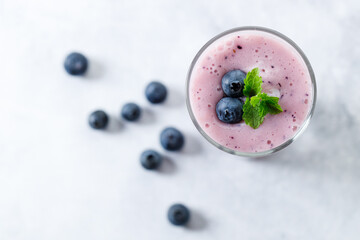 Wall Mural - Blueberry smoothie with yogurt in a glass.