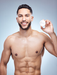 Wall Mural - Skincare, portrait and man with face cream jar for clean beauty and shine results for healthy glow in studio. Model guy, dermatology and sunscreen container with moisture benefits by gray background