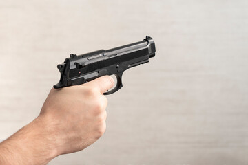 Man hand with glock pistol handgun weapon. firearms for self-defense. concept of legalizing the sale of weapons