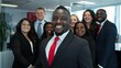 © MD Media - A group of African American business professionals standing in front, smiling and looking at the camera Multiethnic business people working together in the office