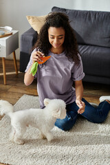 Wall Mural - Woman sitting, bonding with white bichon frise dog on floor.