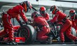 © Handz - Formula One Racing Pit Stop: Red Jumpsuit Team, High-Speed Tire Change, Seamless Teamwork, Intense Competition