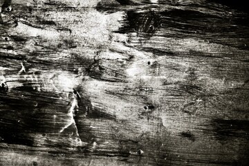 Wall Mural - A black and white photo of a wooden surface with a lot of brush strokes