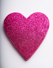 Pink heart glitter shape on white background