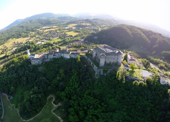 Wall Mural - Aerial view of the small village of Compiano and the castle of Compiano. Compiano, Parma, Italy