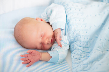 Canvas Print - Newborn baby boy in white bassinet