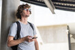 © Art_Photo - Portrait of hipster handsome man relax using digital smartphone.Young man working or study, chatting social network and playing game online or social media, shopping online at city