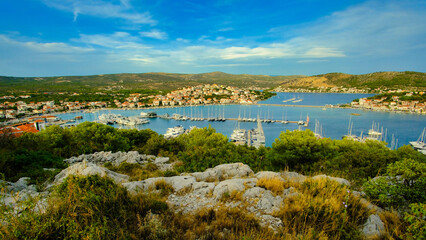 A beautiful view of a harbor with many boats and a clear blue sky